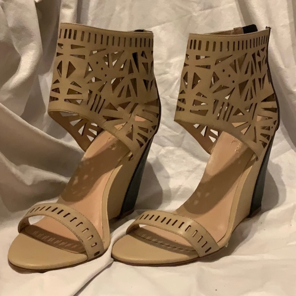 Tan and black sandal boots with wedge heel
